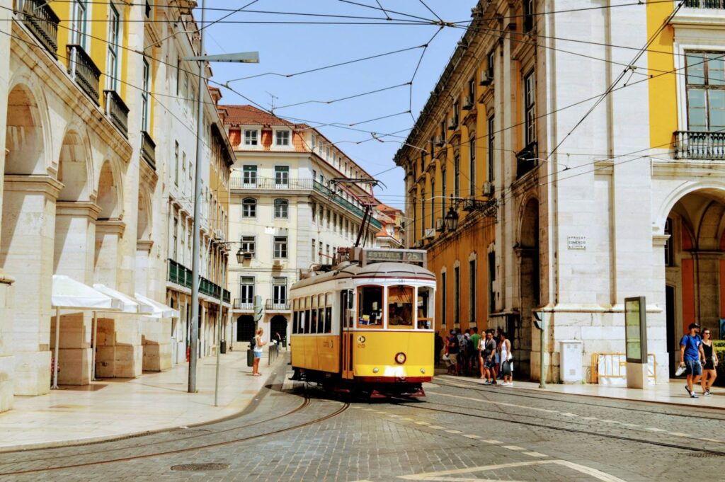 Tram in Lisbon — Europe travel destinations Historic tram in Lisbon's Alfama district — Europe travel destinations