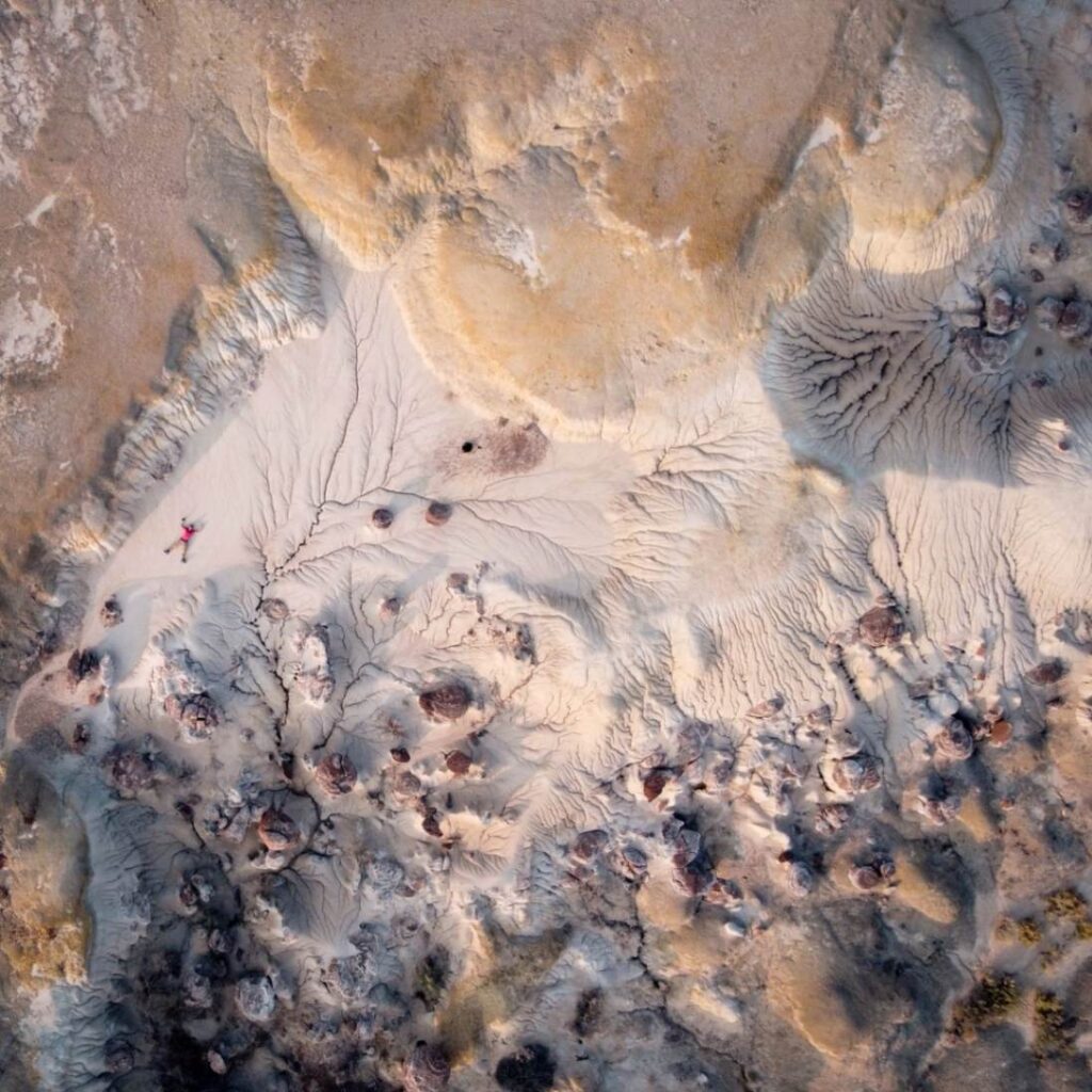 Bisti/De-Na-Zin Wilderness Aerial View — secret places in the USA Aerial view of unique geological formations in Bisti/De-Na-Zin Wilderness, showcasing hidden gems — secret places in the USA
