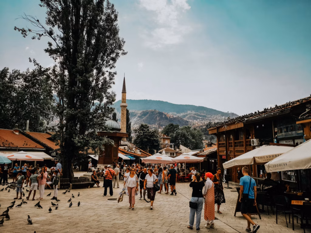 Bosnia and Herzegovina's Vibrant Streets — underrated countries to visit Bosnia and Herzegovina's vibrant streets with historical architecture and people enjoying — underrated countries to visit