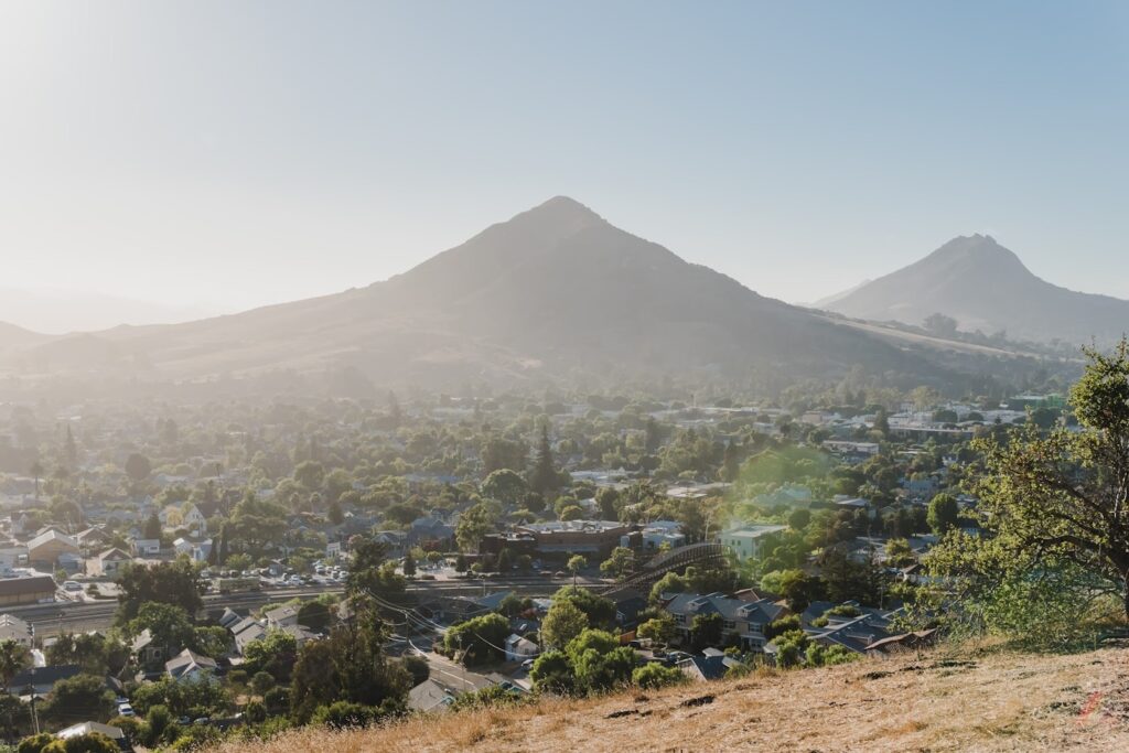 California Coastal View — Places to Visit in the Western USA Scenic view of mountains and a town in California along the Pacific Coast Highway. — Places to Visit in the Western USA