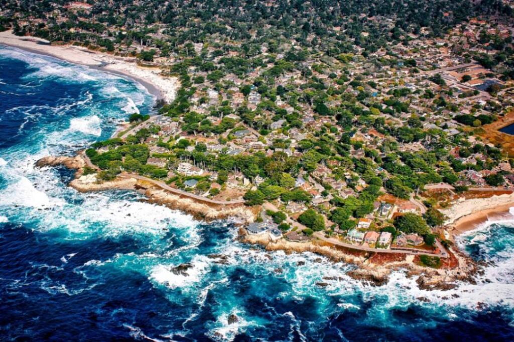 Carmel-by-the-Sea Aerial View — charming small towns in the USA Aerial view of Carmel-by-the-Sea showcasing coastal cliffs and charming homes. — charming small towns in the USA
