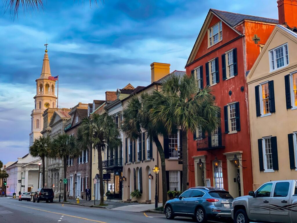 Charleston Historic District — best weekend getaways USA Historic buildings in Charleston, South Carolina with palm trees lining the street. — best weekend getaways USA