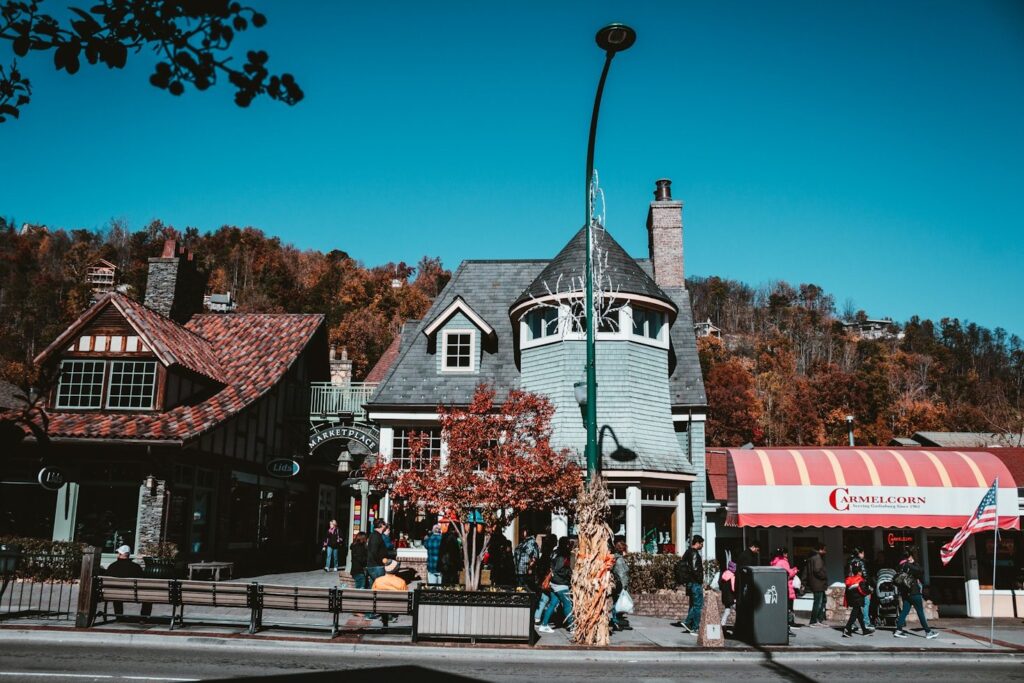 Charming Town in Autumn — cheap places to travel in USA Charming buildings in a small town with autumn foliage in the background. — cheap places to travel in USA