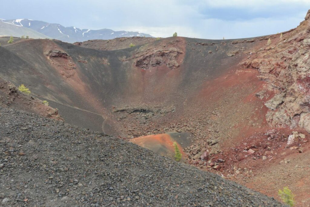 Craters of the Moon National Monument — secret places in the USA Craters of the Moon National Monument landscape with volcanic terrain and colorful rock — secret places in the USA