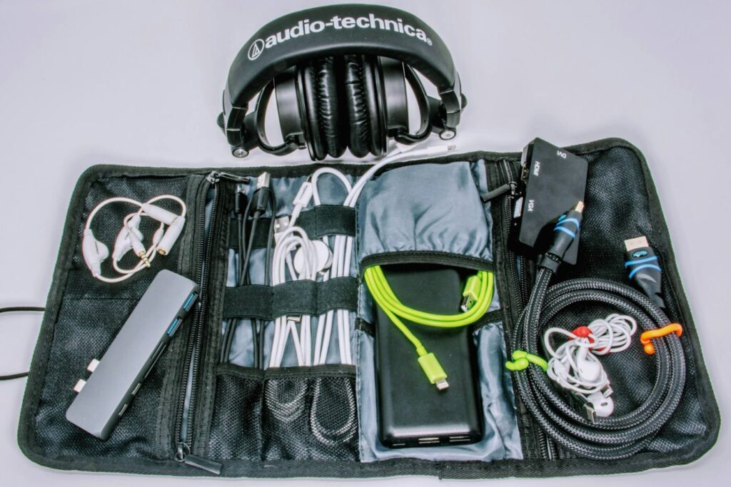 Travel Tech Organizer Essentials — carry-on packing essentials Compact travel tech organizer with cables and headphones — carry-on packing essentials
