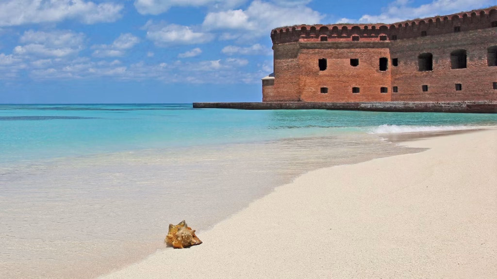 Dry Tortugas National Park — unique travel destinations in the USA Dry Tortugas National Park with Fort Jefferson and clear blue water — unique travel destinations in the USA