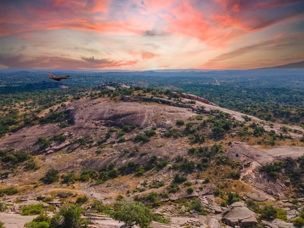 Enchanted Rock Sunset — road trip USA ideas Scenic view of Enchanted Rock in Texas Hill Country during sunset — road trip USA ideas