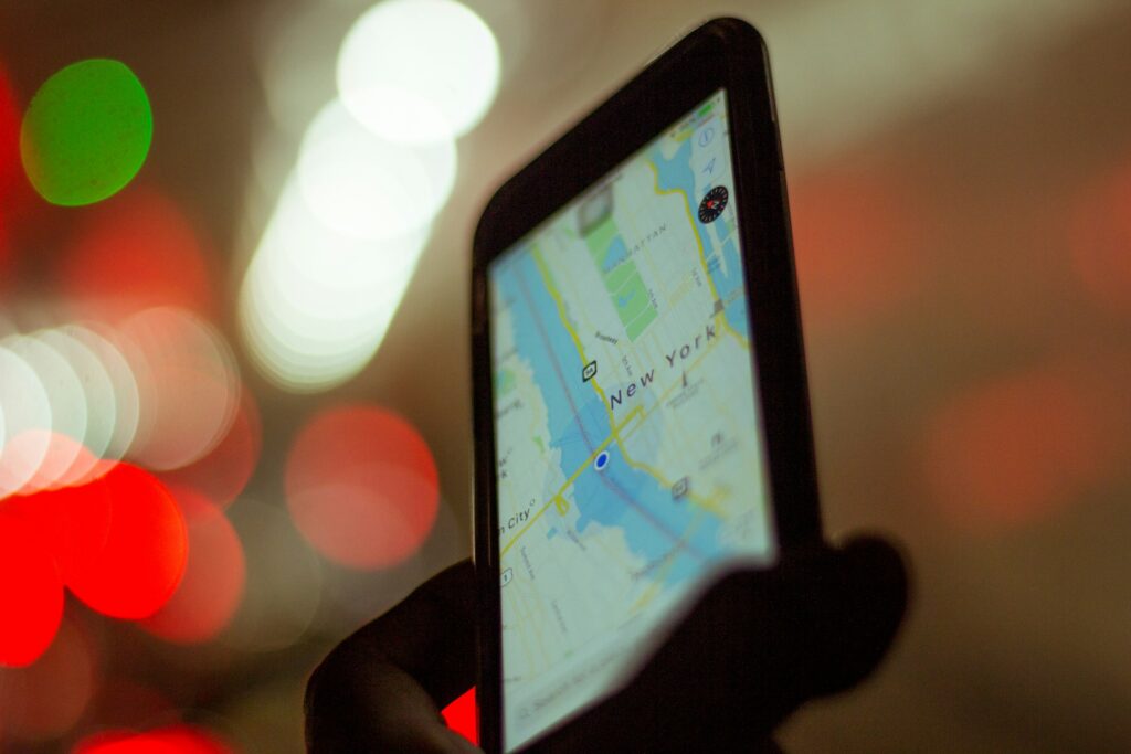 Smartphone Map Navigation — Solo Travel Safety Tips Smartphone displaying a map with a blue location marker — Solo Travel Safety Tips