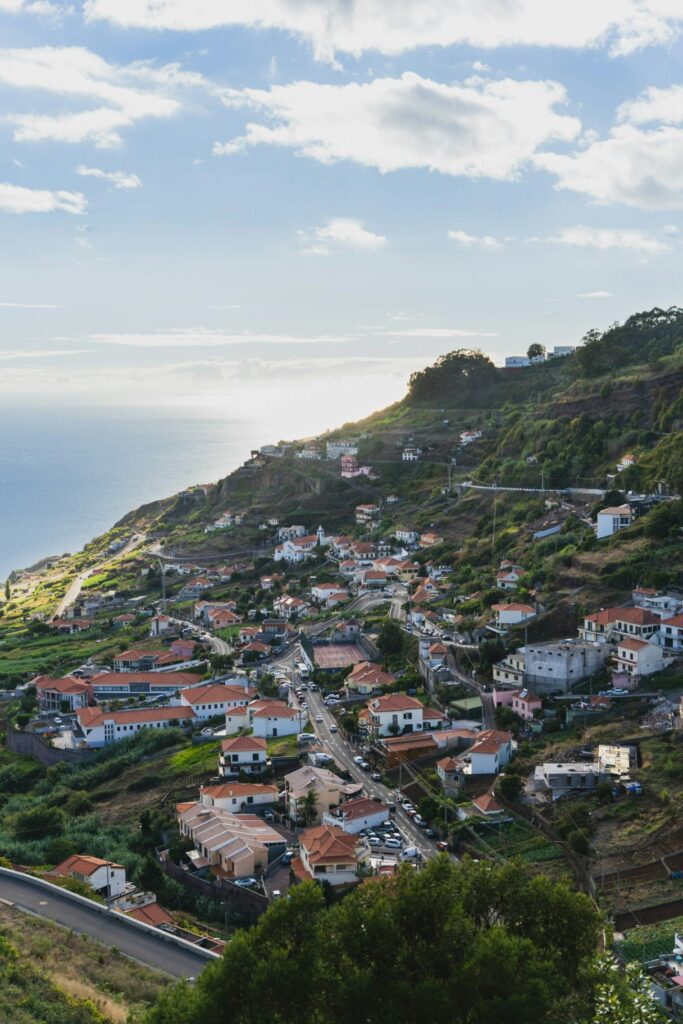 Coastal View of Madeira, Portugal — beautiful getaways in Europe Beautiful coastal view of Madeira, Portugal with houses on a hillside. — beautiful getaways in Europe