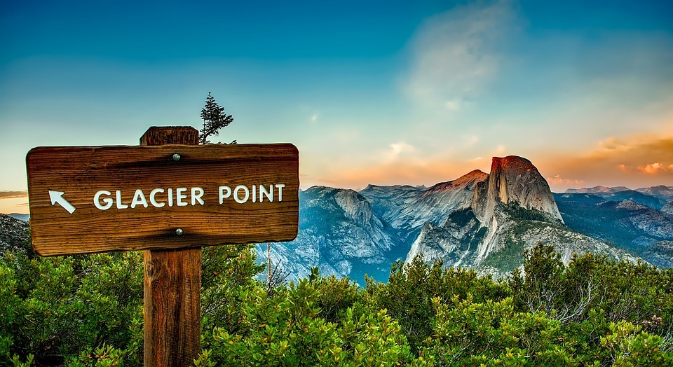 Glacier Point at Yosemite — Places to Visit in the Western USA Glacier Point sign with Half Dome in the background at Yosemite National Park — Places to Visit in the Western USA