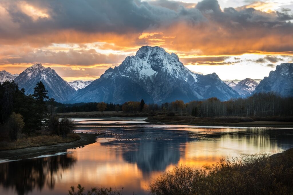 Grand Teton National Park — Places to Visit in the Western USA Grand Teton National Park landscape with mountains and lake at sunset — Places to Visit in the Western USA