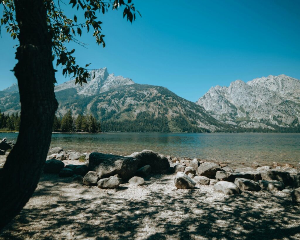 Grand Teton National Park — RV USA road trip routes Scenic view of Grand Teton National Park with mountains and clear water. — RV USA road trip routes