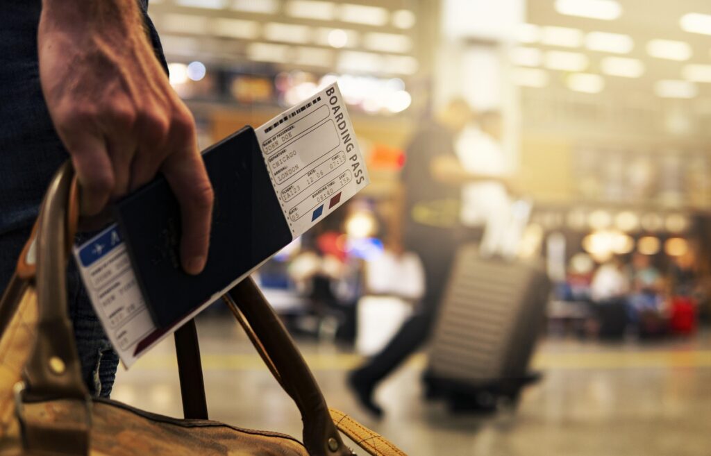 Solo Travel Preparation — Solo Travel Safety Tips Solo travel preparation with passport and boarding pass in hand. — Solo Travel Safety Tips