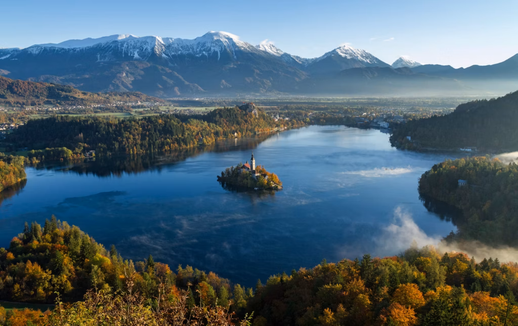 Lake Bled in Slovenia — underrated countries to visit Stunning view of Lake Bled in Slovenia with mountains in the background. — underrated countries to visit