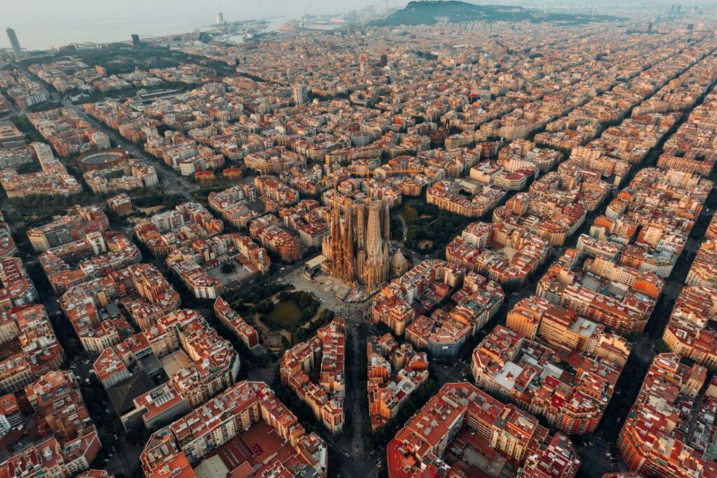 Barcelona Aerial View — Europe travel destinations Aerial view of Barcelona showcasing its unique architecture and urban layout. — Europe travel destinations