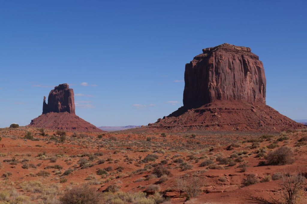 Monument Valley Rock Formations — RV USA road trip routes Monument Valley rock formations under a clear blue sky — RV USA road trip routes
