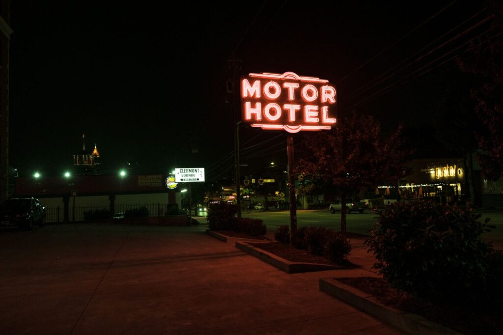 Motor Hotel Sign at Night — USA cross-country road trip Motor hotel sign illuminated at night — USA cross-country road trip