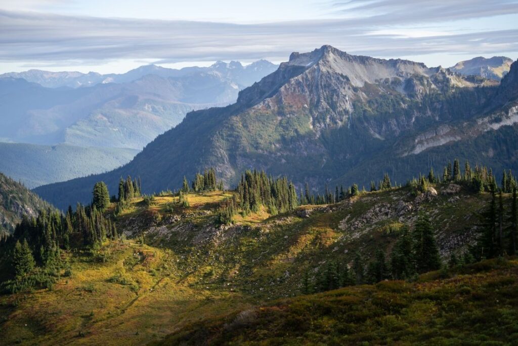 Mount Rainier National Park — Places to Visit in the Western USA Mount Rainier National Park landscape with mountains and greenery — Places to Visit in the Western USA