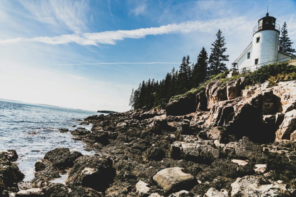 New England Coast RV Trip — RV USA road trip routes New England Coast and Acadia RV Road Trip with rocky coastline and lighthouse — RV USA road trip routes