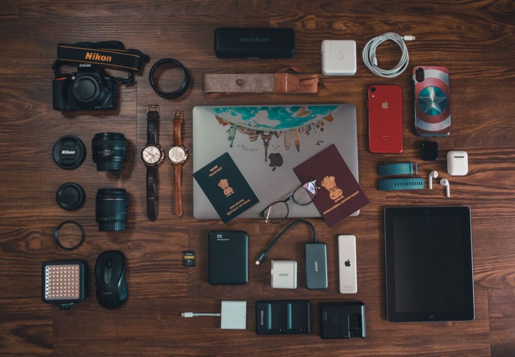 Travel Essentials Checklist Items Travel essentials checklist items including phone, chargers, power bank, and travel adapter.