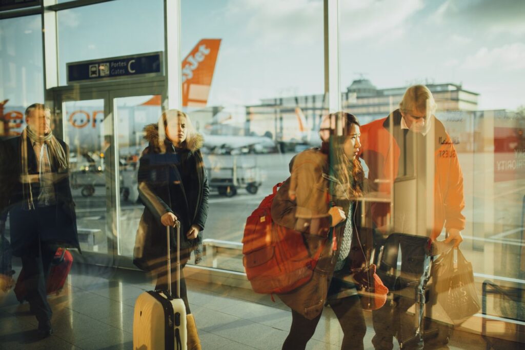 Lightweight, Reliable Luggage — Travel Essentials Travel essentials including lightweight luggage at an airport