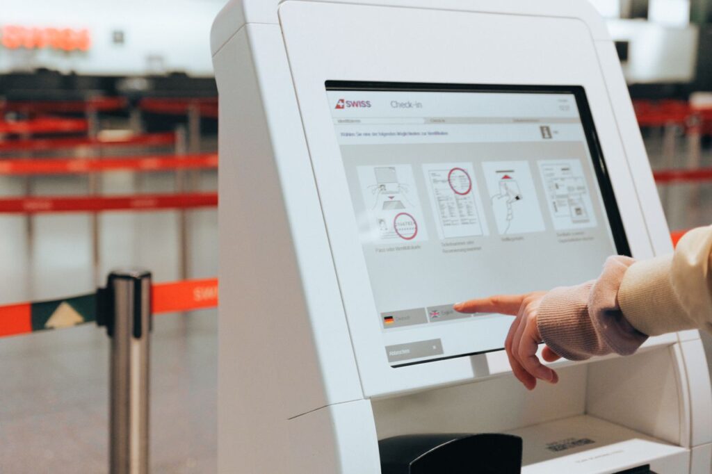 Self-Service Check-In Kiosk — smoother airport experience Self-service check-in kiosk at the airport — smoother airport experience