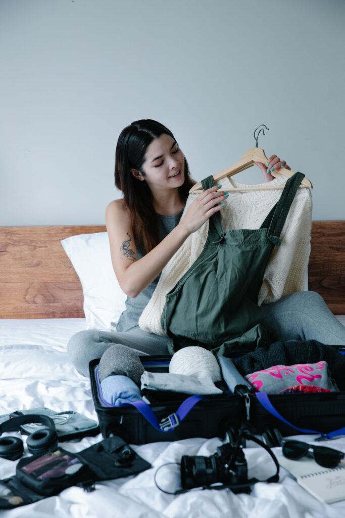 Travel Essentials for Women Travel essentials for women including clothing layers and accessories.
