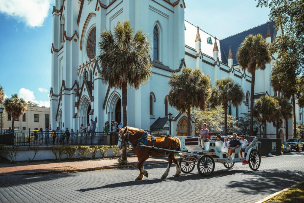 Savannah, Georgia Carriage Ride — best weekend getaways USA Horse-drawn carriage in Savannah, Georgia near historic architecture. — best weekend getaways USA