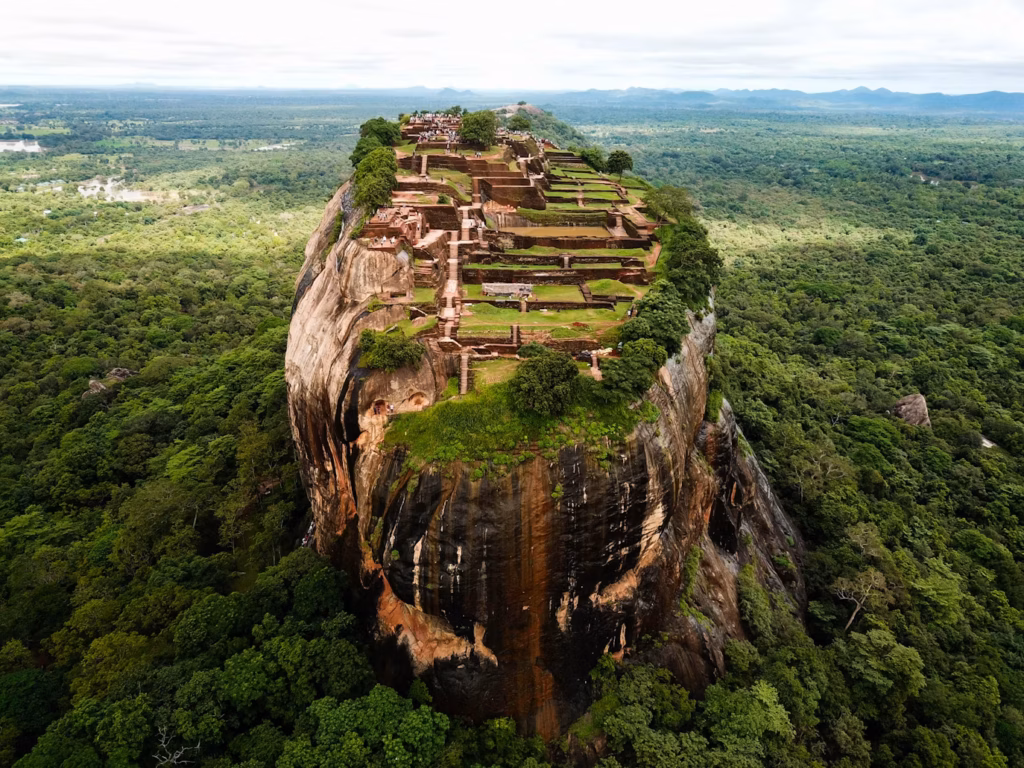 Sigiriya Rock Fortress — underrated countries to visit Sigiriya Rock Fortress in Sri Lanka, an ancient rock fortress surrounded by lush greenery. — underrated countries to visit