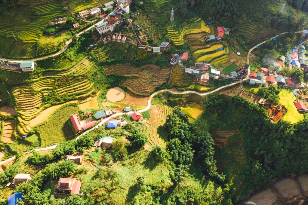 Terraced Fields in Laos — underrated countries to visit Aerial view of terraced fields and small villages in Laos, showcasing lush landscapes. — underrated countries to visit
