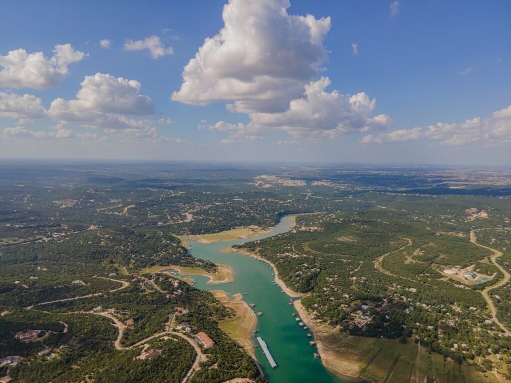 Texas Hill Country Aerial View — road trip USA ideas Aerial view of Texas Hill Country with a winding river and lush greenery. — road trip USA ideas