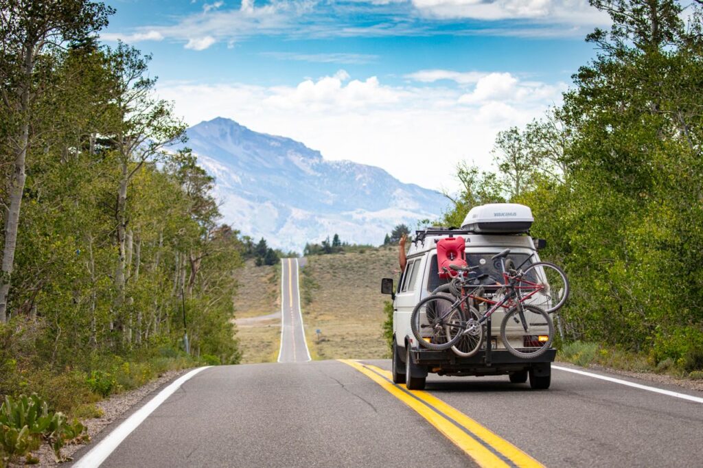 USA Cross-Country Road Trip USA cross-country road trip with a van and bicycles on a scenic highway