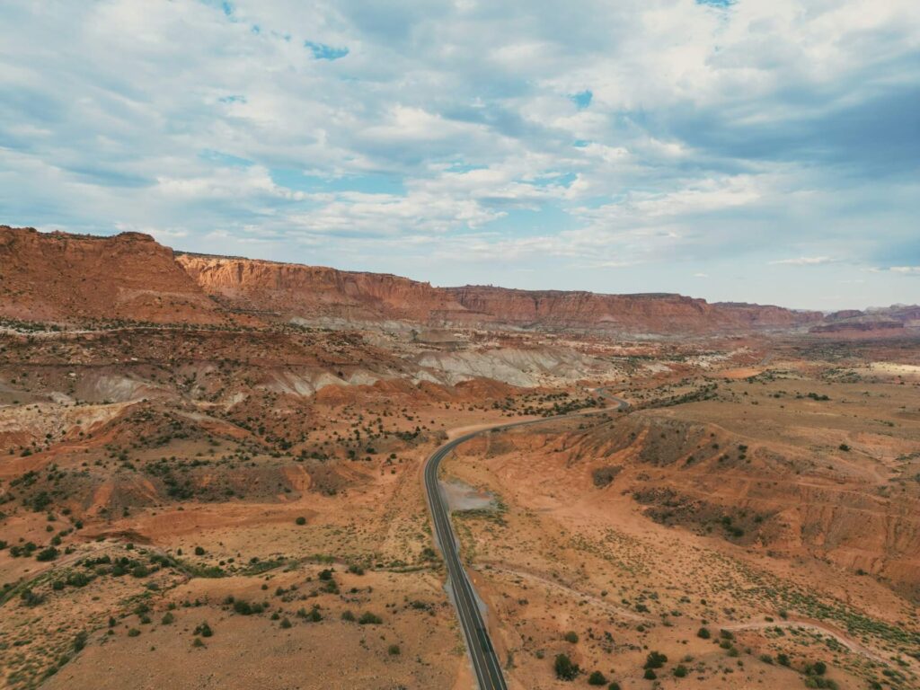 Utah Mighty 5 RV Road Trip — RV USA road trip routes Scenic view of a winding road through Utah's desert landscape. — RV USA road trip routes