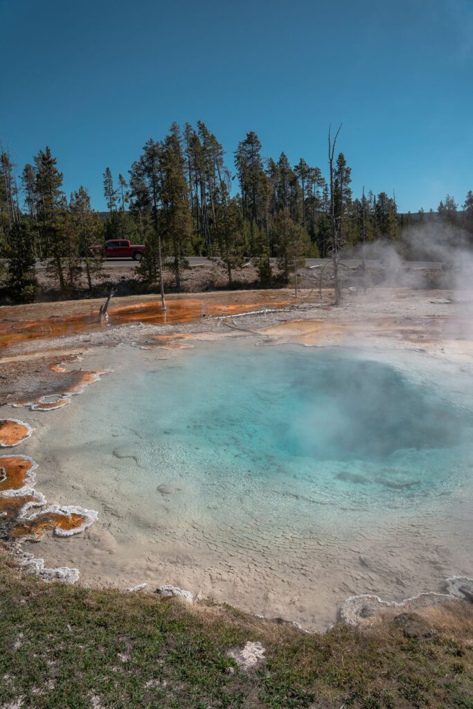 Yellowstone Geothermal Feature — RV USA road trip routes Yellowstone geothermal feature with vibrant colors and steam — RV USA road trip routes