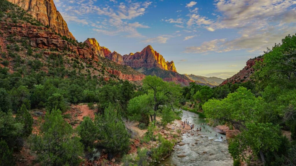 Zion National Park Landscape — beautiful places in America to visit Beautiful landscape of Zion National Park with mountains and a river under a blue sky. — beautiful places in America to visit